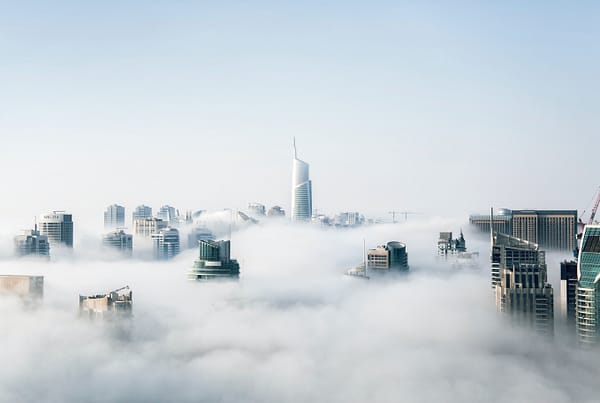 High-rise buildings above the clouds.